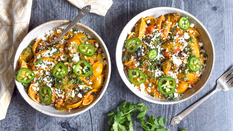 1-pot turkey taco pasta in bowls with garnish