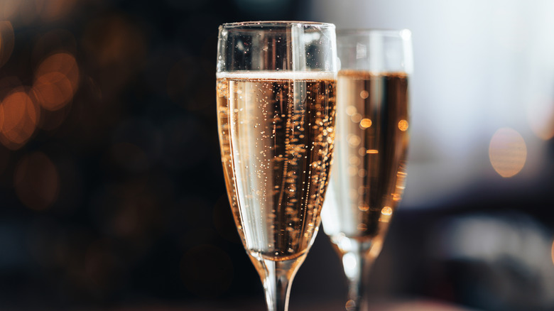 Close up of two flutes of Champagne