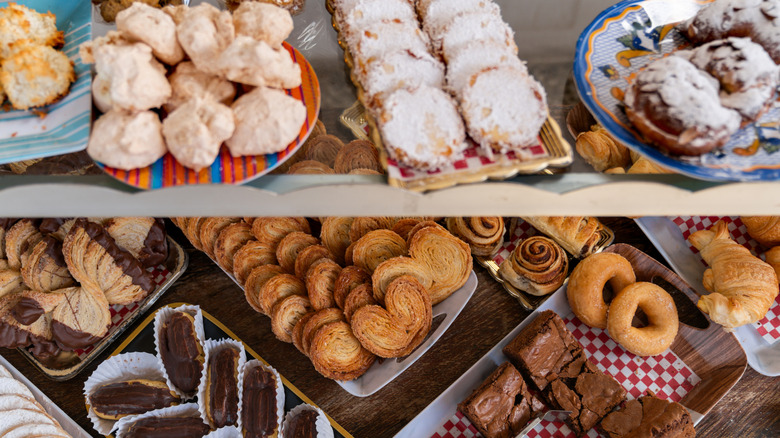 Assorted French pastries in a bakery display case.