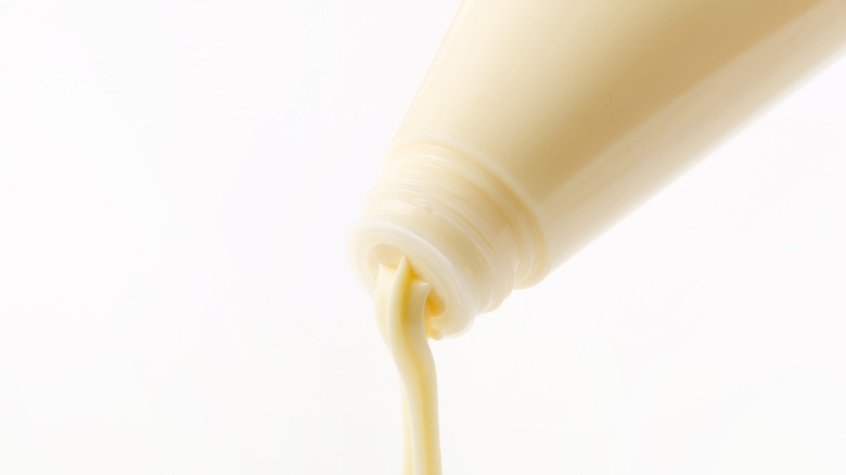 Japanese mayo bottle being squeezed