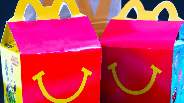 Two Happy Meal boxes with a smile design