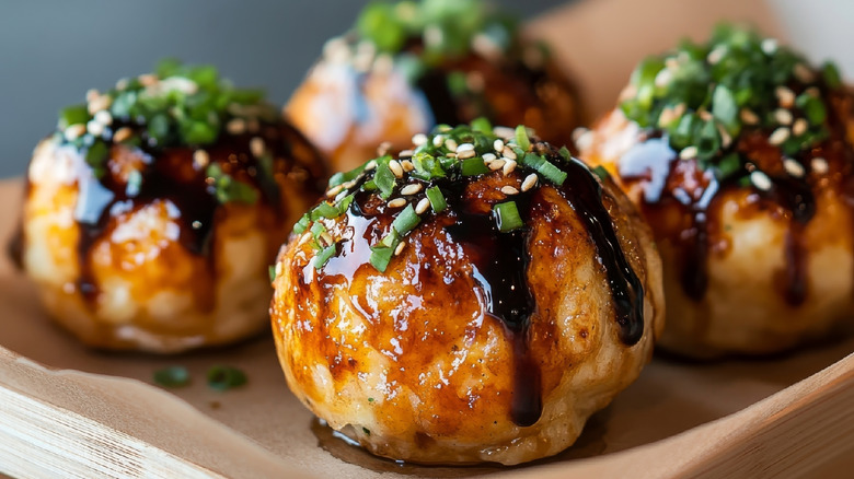 close up takoyaki with sauce